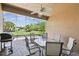 Screened-in lanai with tile flooring and seating area perfect for outdoor dining at 130 Los Gatos Pl, Kissimmee, FL 34759