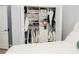 Bedroom walk-in closet with custom shelving, hanging racks, and dresser at 1302 Moss Creek Ln, Davenport, FL 33896