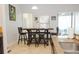 An eat-in kitchen featuring a breakfast table, seating for six, and a view of the outdoors at 1302 Moss Creek Ln, Davenport, FL 33896