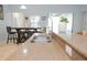 Beautiful kitchen featuring granite countertops, a stainless steel sink and faucet, and a breakfast bar at 1302 Moss Creek Ln, Davenport, FL 33896