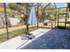 Inviting screened outdoor patio with lush greenery, paving, and a shaded area for relaxation at 1302 Moss Creek Ln, Davenport, FL 33896