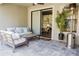 Cozy screened patio features modern furniture, a heater, and a view of the backyard at 1302 Moss Creek Ln, Davenport, FL 33896
