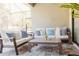 Relaxing screened patio with stylish furniture, plush cushions, and serene outdoor views at 1302 Moss Creek Ln, Davenport, FL 33896