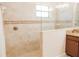 Shower features tiled walls with mosaic accents and glass surround at 1302 Moss Creek Ln, Davenport, FL 33896