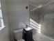 This is a bathroom with a shower, toilet, sink, and a black vanity at 139 Arroyo Pkwy, Ormond Beach, FL 32174