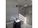 This is a bathroom with a toilet, sink, vanity, and glass enclosed shower at 139 Arroyo Pkwy, Ormond Beach, FL 32174