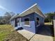 Charming blue home exterior with well-maintained landscaping at 139 Arroyo Pkwy, Ormond Beach, FL 32174