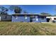 Blue home exterior with a neatly mowed lawn at 139 Arroyo Pkwy, Ormond Beach, FL 32174