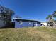 Charming blue home exterior with a lush green lawn at 139 Arroyo Pkwy, Ormond Beach, FL 32174