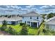 Aerial view of home highlighting backyard, screened patio, and landscaping at 1443 Bunker Dr, Davenport, FL 33836