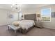 Serene bedroom with tufted headboard, neutral tones, and ample natural light at 1443 Bunker Dr, Davenport, FL 33836