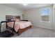 Comfortable bedroom with a large window and neutral carpet at 1443 Bunker Dr, Davenport, FL 33836