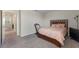 View of the bedroom featuring neutral carpet and decor and a doorway to another room at 1443 Bunker Dr, Davenport, FL 33836