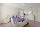 A darling bedroom with carpet floors, lots of natural light and princess decor at 1443 Bunker Dr, Davenport, FL 33836