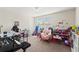 Bedroom or flex space is ready for any hobby; carpet floors, and natural light at 1443 Bunker Dr, Davenport, FL 33836