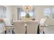 Dining room featuring modern chandelier and lots of natural light at 1443 Bunker Dr, Davenport, FL 33836