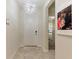 Inviting entryway with tile flooring and a decorative light fixture at 1443 Bunker Dr, Davenport, FL 33836