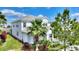 Beautiful home with lush landscaping and a paver driveway leading to a two-car garage at 1443 Bunker Dr, Davenport, FL 33836