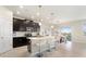 Open kitchen with an island, stainless steel appliances, and sliding glass doors to the patio at 1443 Bunker Dr, Davenport, FL 33836