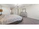 The main bedroom features carpet floors, stylish dresser, and a unique ceiling light fixture at 1443 Bunker Dr, Davenport, FL 33836