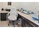 Well-lit office space with desk, cabinets, and comfortable rolling chair at 1443 Bunker Dr, Davenport, FL 33836