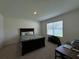 Bedroom with a double bed, one window, carpeted floors, and desk area at 1648 Heart Bar Rd, Kissimmee, FL 34744
