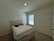 Bedroom with a double bed, one window, and carpeted floors at 1648 Heart Bar Rd, Kissimmee, FL 34744