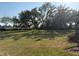 Lush green community area offering a peaceful setting with mature trees and well-maintained landscaping at 1648 Heart Bar Rd, Kissimmee, FL 34744