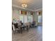 Bright community room featuring tables, chairs and stylish decor at 1648 Heart Bar Rd, Kissimmee, FL 34744