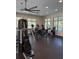 Community fitness center with ample equipment, ceiling fan, and great natural light at 1648 Heart Bar Rd, Kissimmee, FL 34744