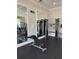 The gym features benches, weights, and mirrors for a complete workout experience for the residents at 1648 Heart Bar Rd, Kissimmee, FL 34744