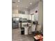 Community kitchen features granite counters, stainless steel appliances, white cabinets, and bar seating at 1648 Heart Bar Rd, Kissimmee, FL 34744