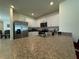 Bright kitchen featuring stainless steel appliances, light countertops, white cabinetry, and tile flooring at 1648 Heart Bar Rd, Kissimmee, FL 34744