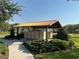 A well-maintained community mailbox station sheltered by a covered structure and surrounded by lush landscaping at 1648 Heart Bar Rd, Kissimmee, FL 34744