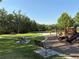 Park with picnic tables, playground, walking path, benches and shade trees at 1648 Heart Bar Rd, Kissimmee, FL 34744