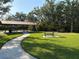 Park pavilion with picnic tables in a shady, landscaped area at 1648 Heart Bar Rd, Kissimmee, FL 34744