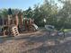 Community playground featuring climbing structures, slides, and interactive musical elements in a natural setting at 1648 Heart Bar Rd, Kissimmee, FL 34744