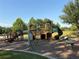 Community playground featuring climbing structures and slides and interactive musical elements in a natural setting at 1648 Heart Bar Rd, Kissimmee, FL 34744