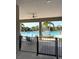 Community pool area featuring sun loungers, tables, and a gated fence for safety at 1648 Heart Bar Rd, Kissimmee, FL 34744