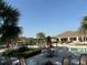 Community pool with seating, umbrellas, and a covered picnic area offers a relaxing atmosphere at 1648 Heart Bar Rd, Kissimmee, FL 34744