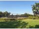 Community tennis court bordered with new fence and landscaped area at 1648 Heart Bar Rd, Kissimmee, FL 34744