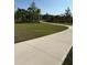 Concrete walking path for residents surrounded by palm trees at 1648 Heart Bar Rd, Kissimmee, FL 34744