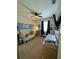 Bedroom featuring a crib, changing table, and blue accent wall at 1859 Shumard Ave, St Cloud, FL 34771