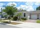 Charming single story home featuring a one-car garage and beautifully landscaped yard at 1859 Shumard Ave, St Cloud, FL 34771