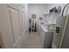 Functional laundry room with tile floors, modern washer, dryer and water heater at 1859 Shumard Ave, St Cloud, FL 34771