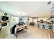 Open-concept living room featuring a fireplace, tile floors, and seamlessly connecting to the kitchen at 1859 Shumard Ave, St Cloud, FL 34771