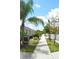 Neighborhood featuring sidewalks lined with green grass, trees, and beautifully landscaped homes at 1859 Shumard Ave, St Cloud, FL 34771