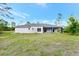 Expansive backyard view highlights the home's exterior, landscaping, and outdoor living space at 19182 Seaview St, Orlando, FL 32833