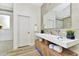 This luxurious bathroom has double sinks, vanity, and an elegant design at 19182 Seaview St, Orlando, FL 32833