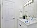Clean bathroom with modern fixtures, white marble sink and a decorative plant, adding a touch of elegance at 19182 Seaview St, Orlando, FL 32833